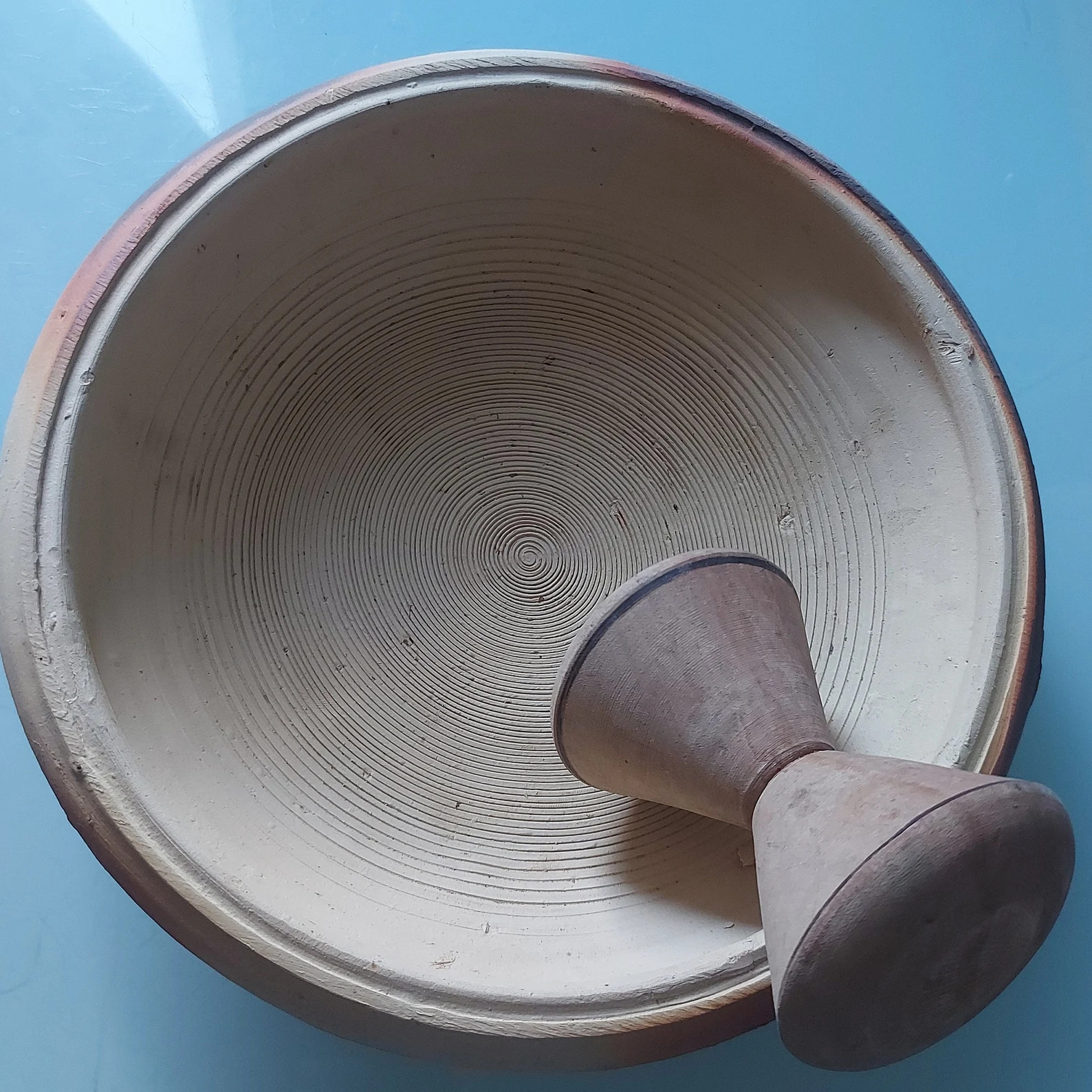 earthenware bowl and grinder