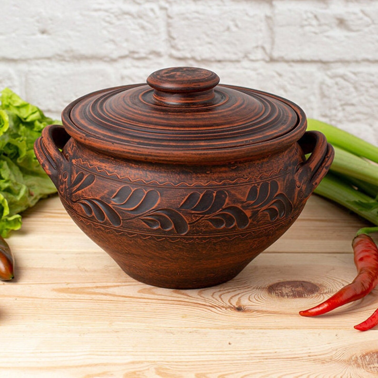 unglazed cooking clay pot with lid